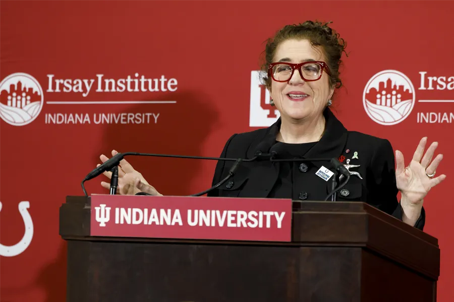 Distinguished Professor of Sociology Bernice Pescosolido speaks at a podium during the launch of the Irsay Institute on March 9, 2023.