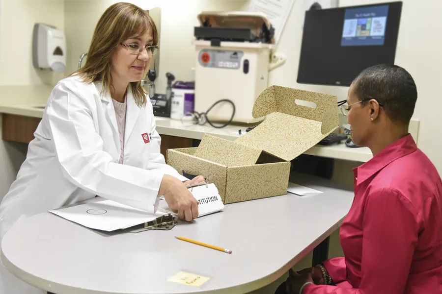 Distinguished Professor and the Barbara and Peer Baekgaard Professor of Alzheimer's Disease Research Liana Apostolova, MD, MS, conducts a research study. 