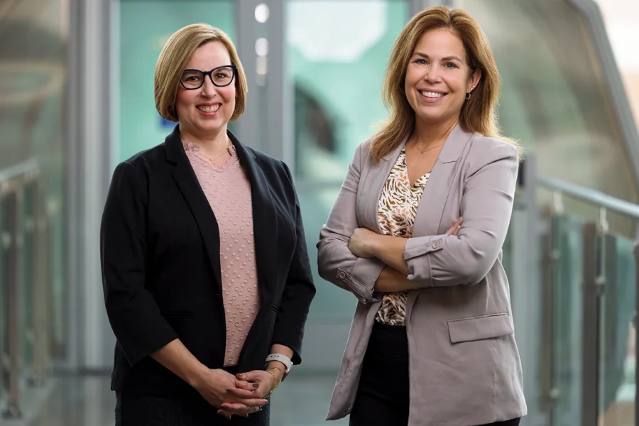 IUI professors and lead researchers for the screening tool Jennifer J. Bute (left) and Maria Brann (right) pose in the Campus Center.