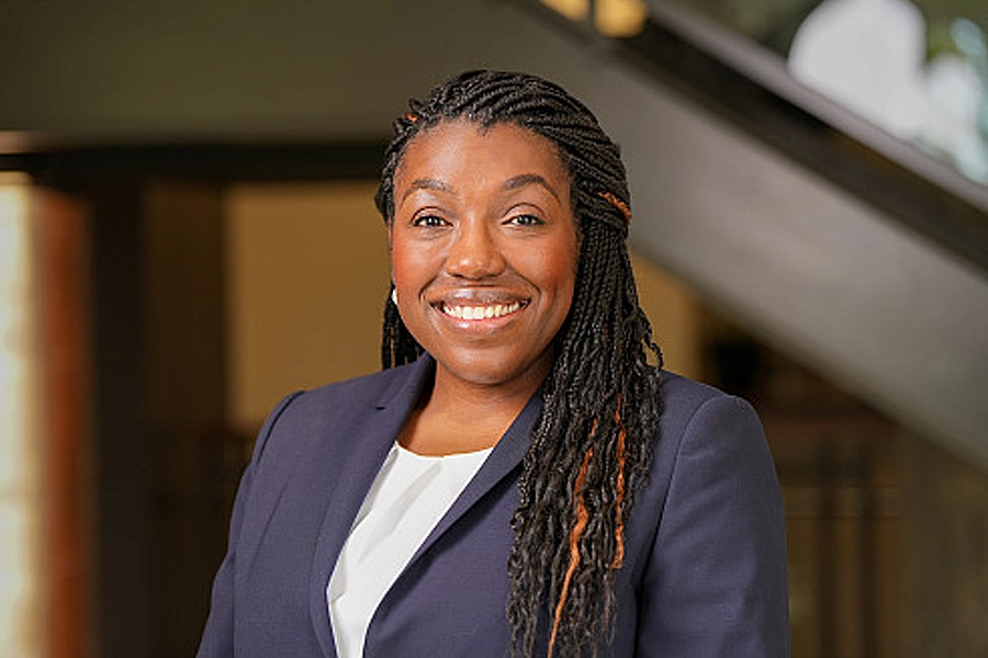 Dr. Lauren Nephew, assistant professor of medicine and vice chair of health equity at the Indiana University School of Medicine, smiles and poses.