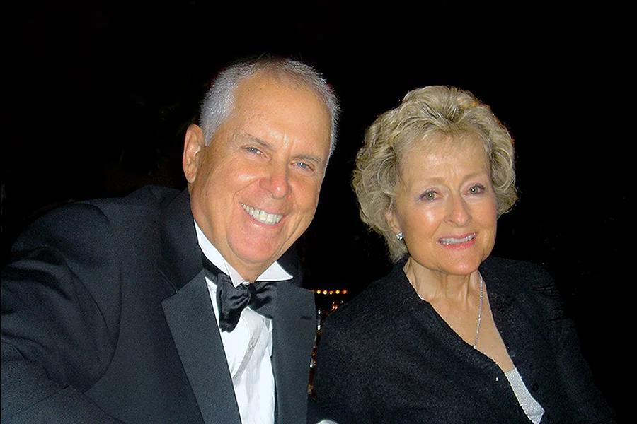 Tom Wood (left) and Julie Wood pose during a formal event.