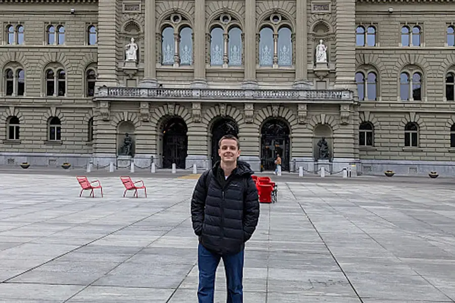 Capper Howard, a Fulbright awardee, stands in front of the Federal Palace of Switzerland (Bern, Switzerland)