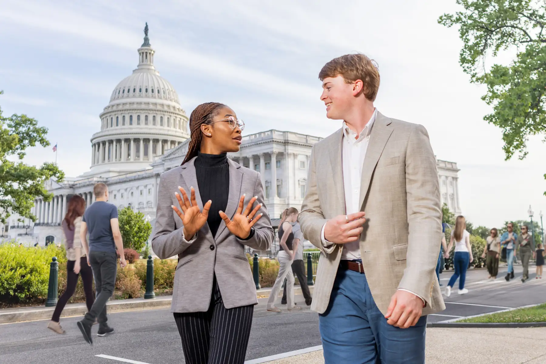 A female and male student talk near the US Capitol building in Washington, DC