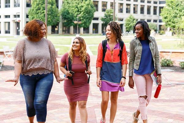 Group of female undergraduate students walking on the IU Indianapolis campus.
