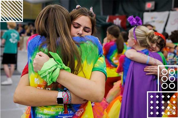 Students show support to each other through hugs.
